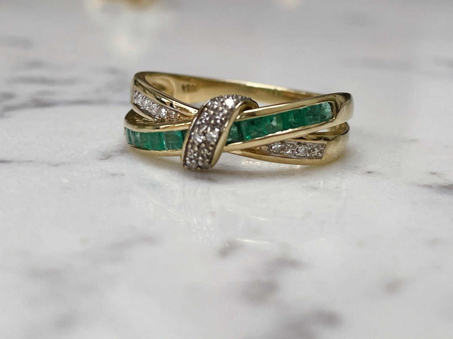 Emerald and diamond crossover ring - The Goldfinch Collection